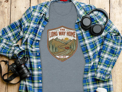 Rugged The Long Way Home | Vintage Adventure Wilderness Shirt: Grey t-shirt with "The Long Way Home Est. 1974" shield logo featuring a mountain landscape.