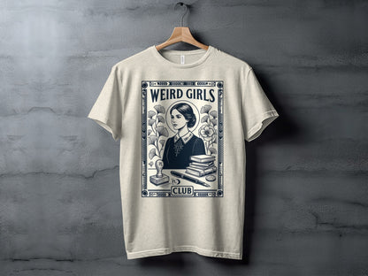 Cream t-shirt with "Weird Girls Club" text and vintage illustration of a woman and books.