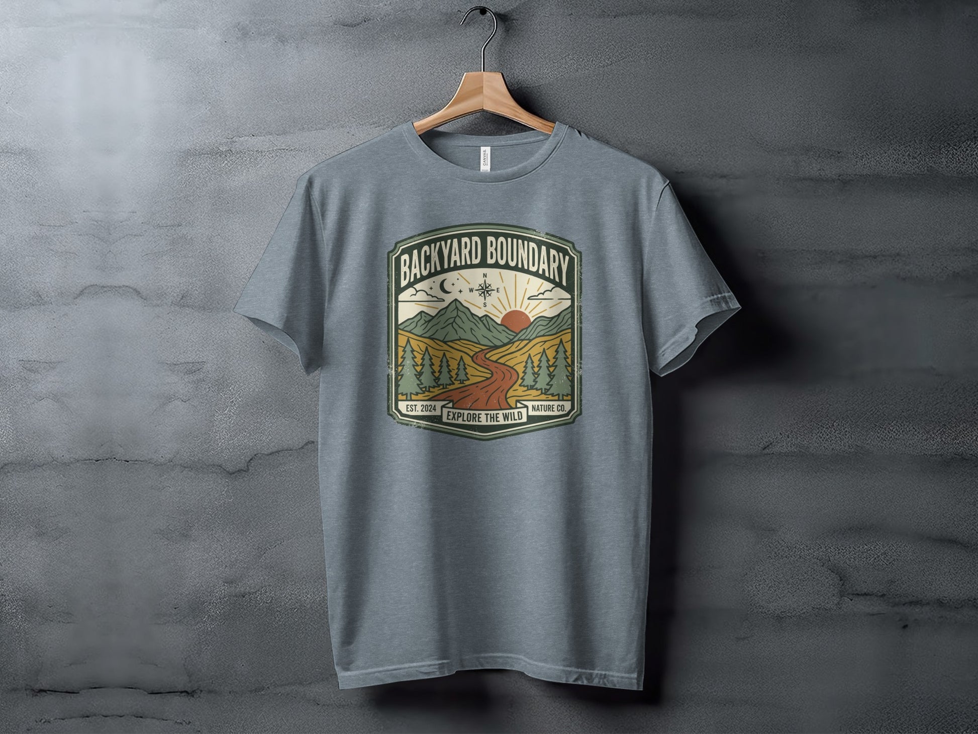 Rugged Backyard Boundary: Explore The Wild Wilderness Shirt: Backyard Boundary Explore the Wild t-shirt with mountain and sun graphic.