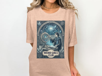 T-shirt graphic: woman with globe and celestial designs, text "WEIRD GIRLS CLUB".