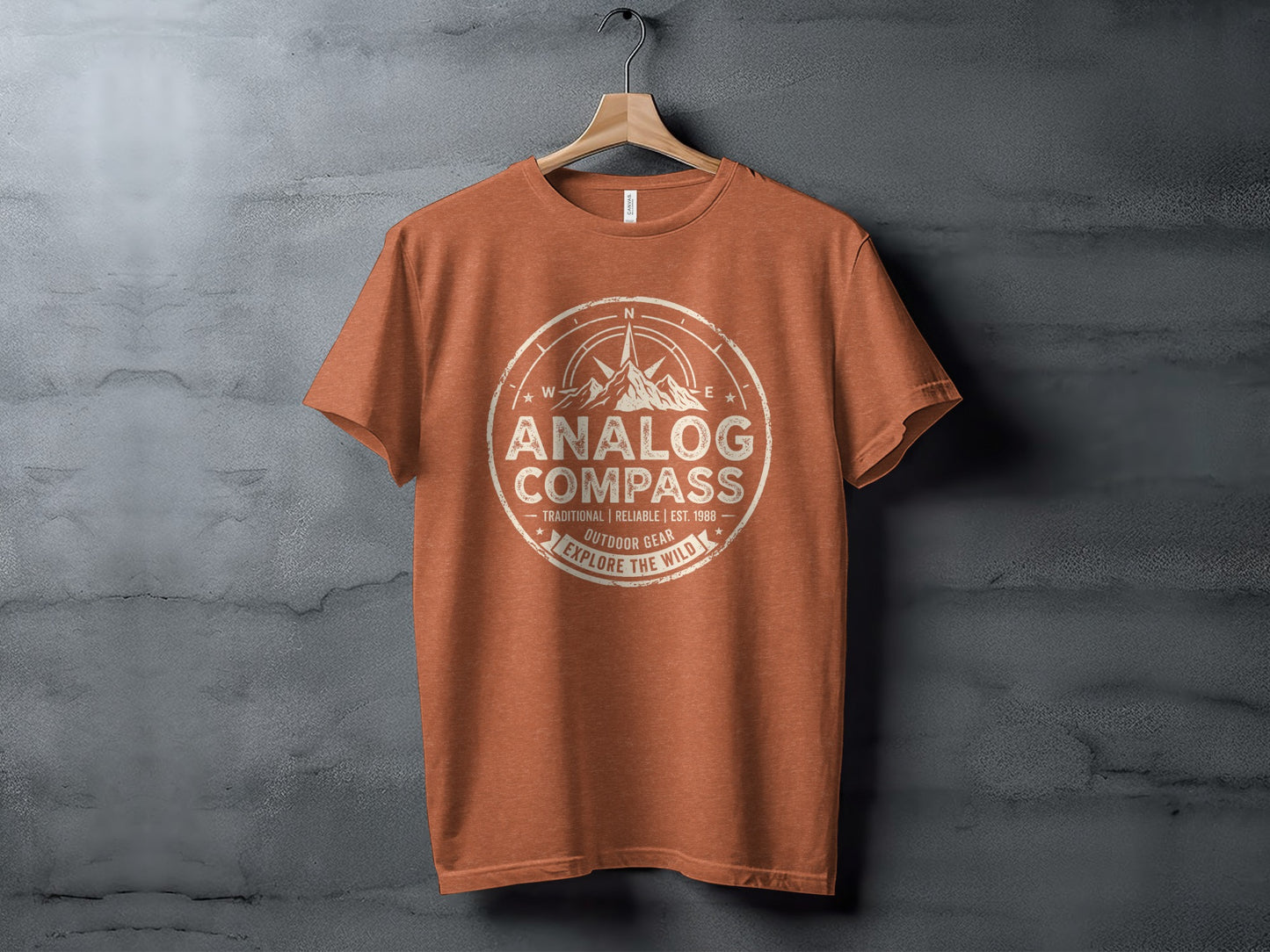 Analog Compass Heritage: The Explorer's Adventure Tee: Orange t-shirt with "Analog Compass" and compass design.