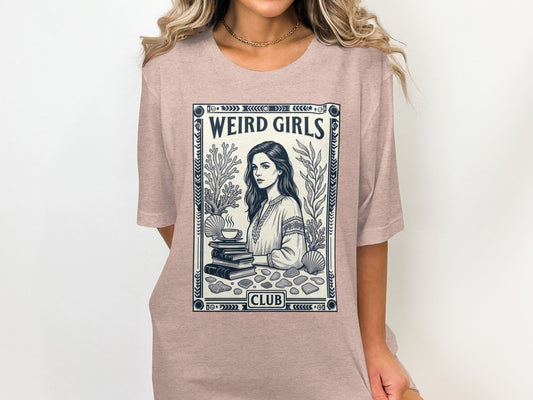 T-shirt with "Weird Girls Club" text and illustration of a woman reading.