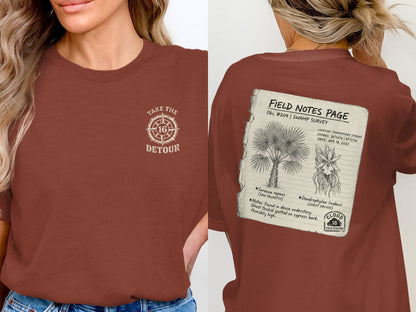 T-shirt with "Take the Detour" logo on front, and field notes with plant illustrations on back.