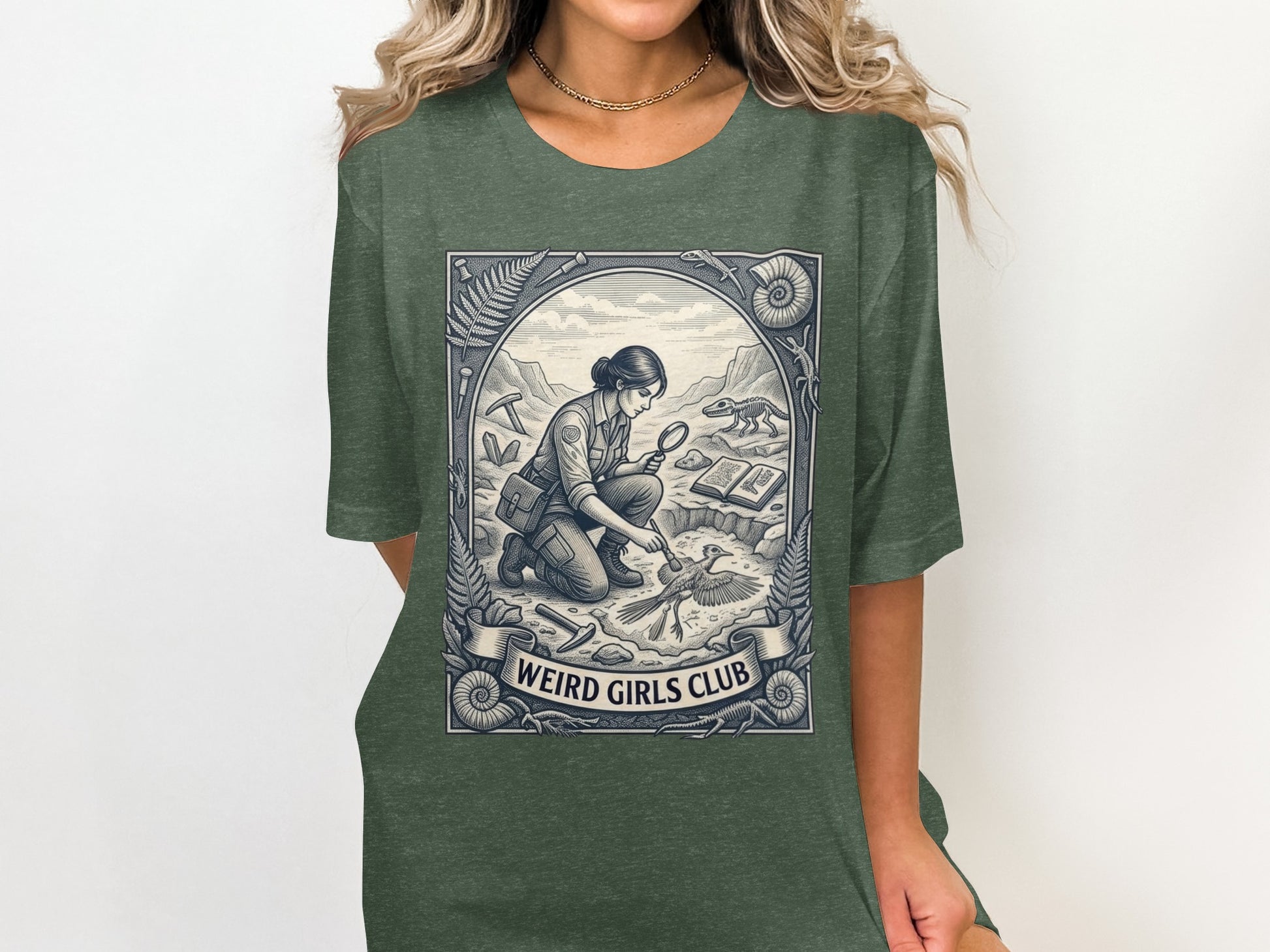 T-shirt graphic of a paleontologist examining a fossil within a circular border.