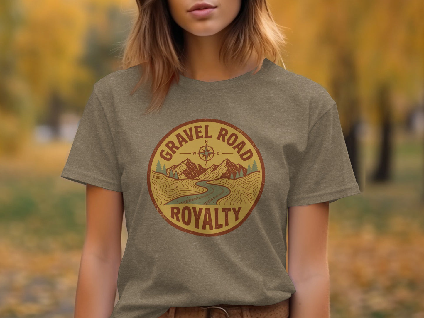 Gravel Road Royalty Adventure Tee | Vintage Outdoor Apparel: Gravel Road Royalty circular logo with mountains, river, and compass.