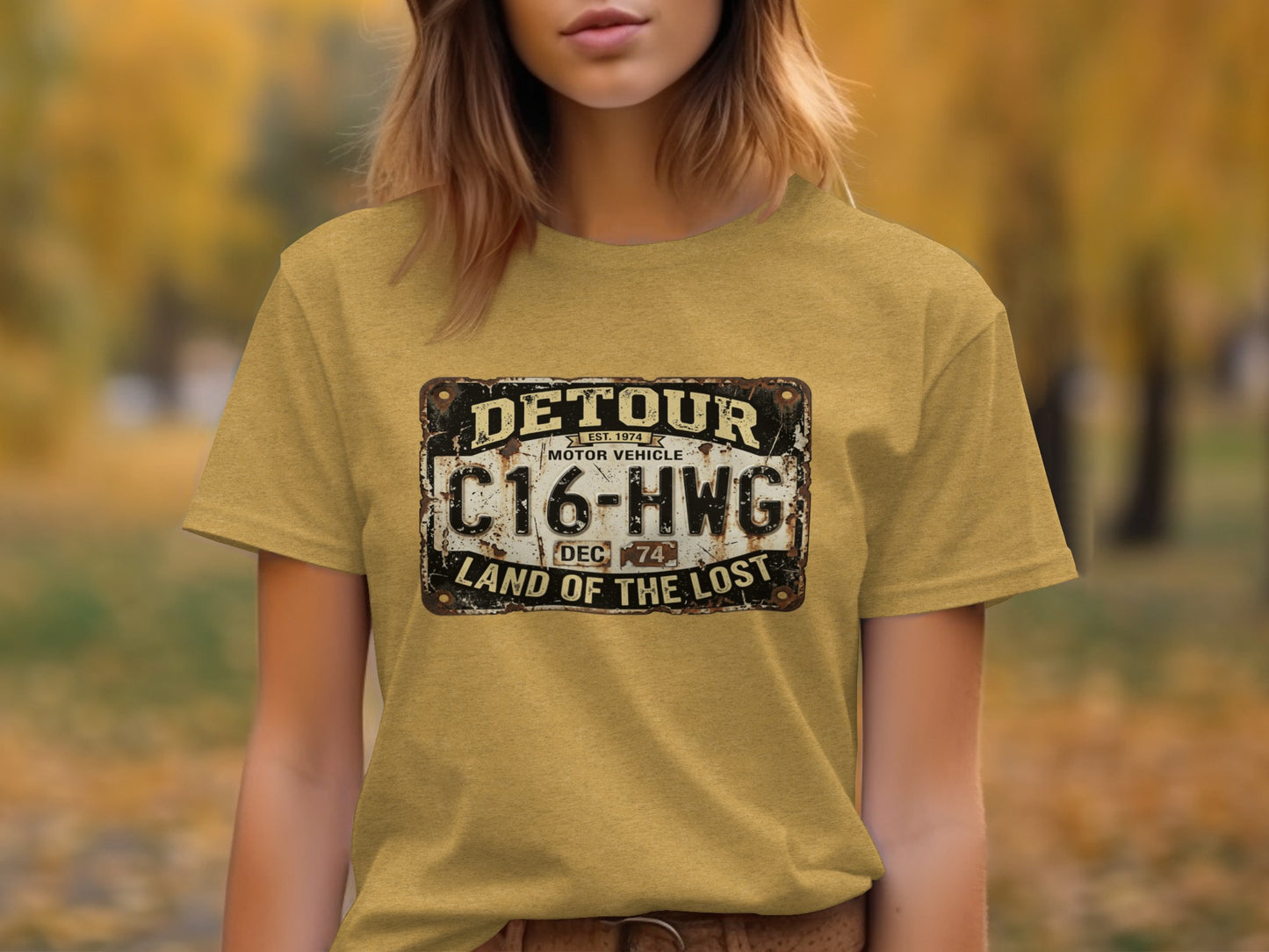 Detour 'Land of the Lost' Vintage | Vintage Outdoor Apparel: Yellow t-shirt with a distressed license plate graphic: DETOUR, C16-HWG, LAND OF THE LOST.
