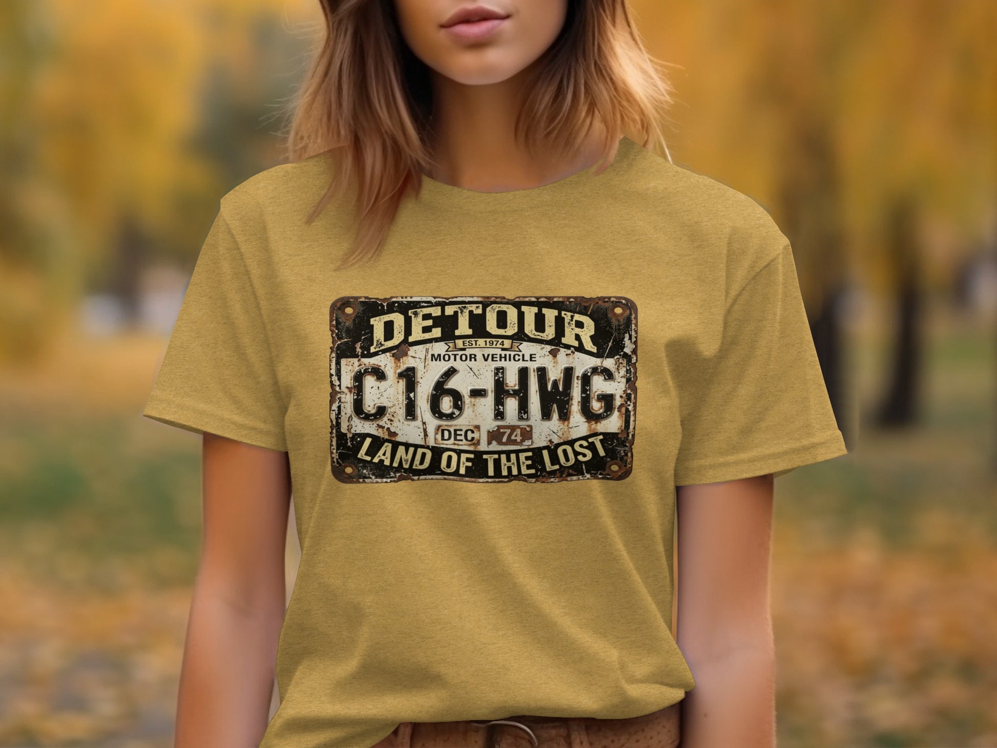 Detour 'Land of the Lost' Vintage | Vintage Outdoor Apparel: Yellow t-shirt with a distressed license plate graphic: DETOUR, C16-HWG, LAND OF THE LOST.