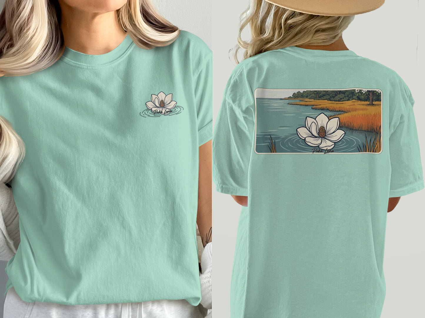 Mint green t-shirt with a lotus flower graphic on front and landscape on back.