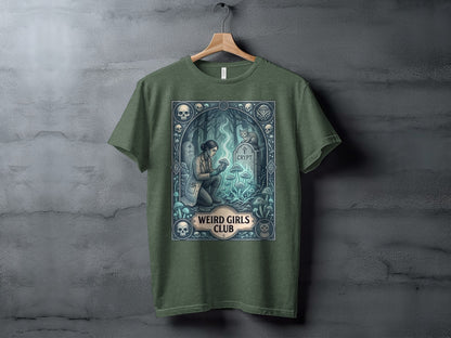 Green t-shirt with "Weird Girls Club" crypt and mushroom design.