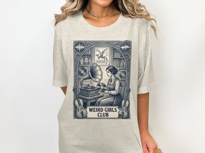 T-shirt graphic of a woman at a vintage phonograph, with text "WEIRD GIRLS CLUB".
