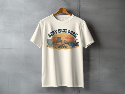 Cream t-shirt with "STAY PAST DARK" text over campfire, chairs, and log graphic.