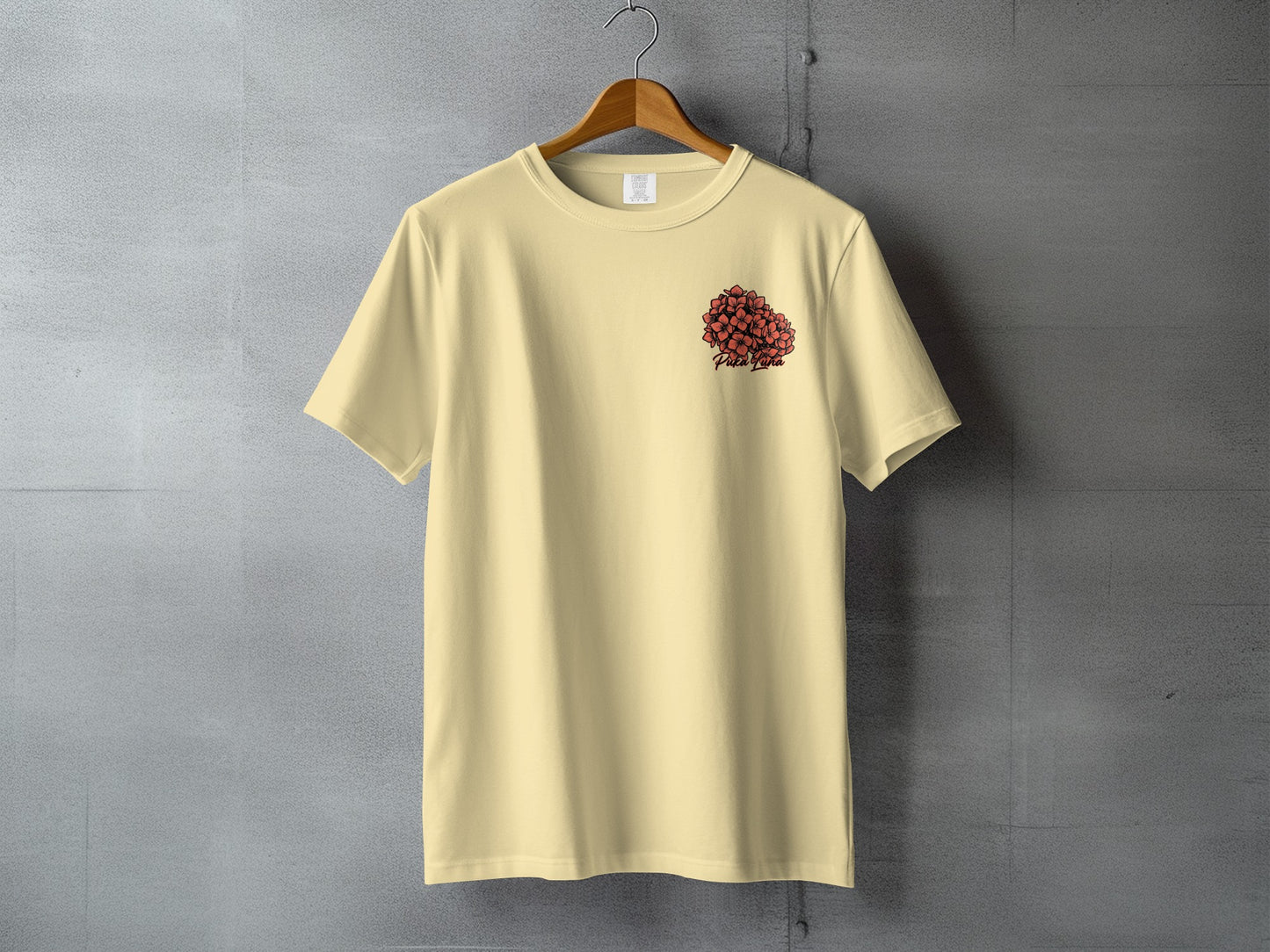 Pale yellow t-shirt with a cluster of red hearts graphic and "Pure Pure" text.