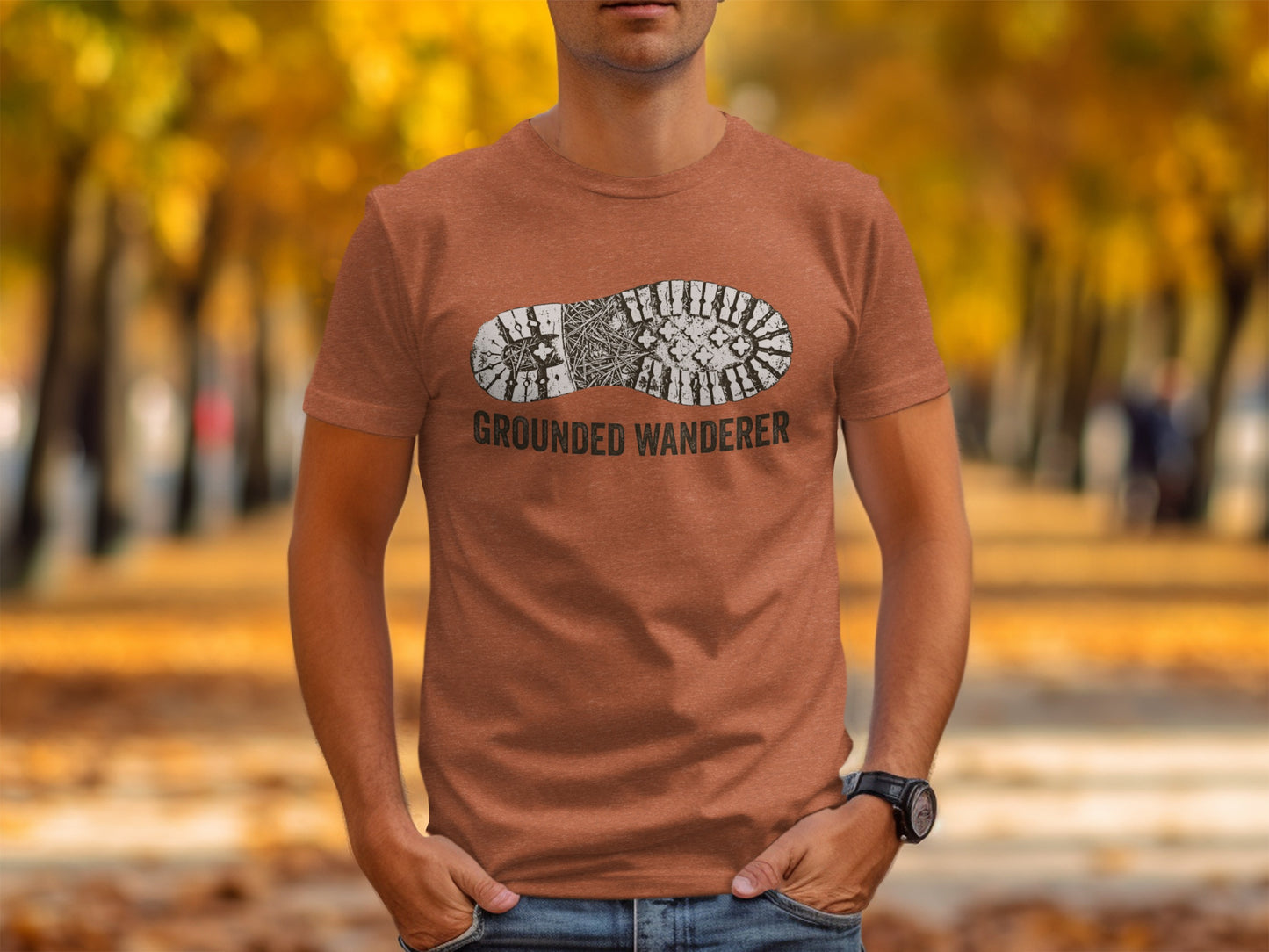 Grounded Wanderer Boot Print | Vintage Outdoor Apparel: Brown t-shirt with "GROUNDED WANDERER" text and boot print graphic.