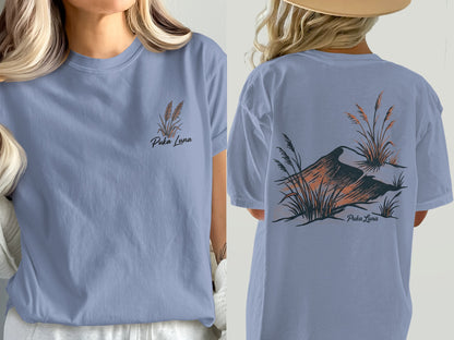 Puka Luna t-shirt with a minimalist design of wheat stalks and a bird on back.