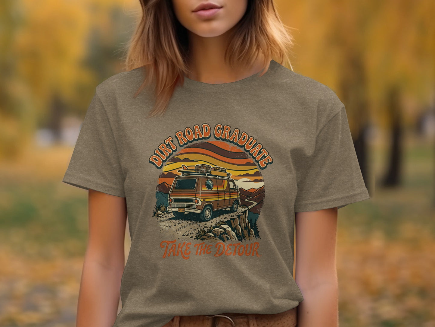 Heritage Dirt Road Graduate Adventure Tee Nomad Tee: T-shirt graphic with vintage van, mountains, sunset, and text "Dirt Road Graduate Take The Detour".