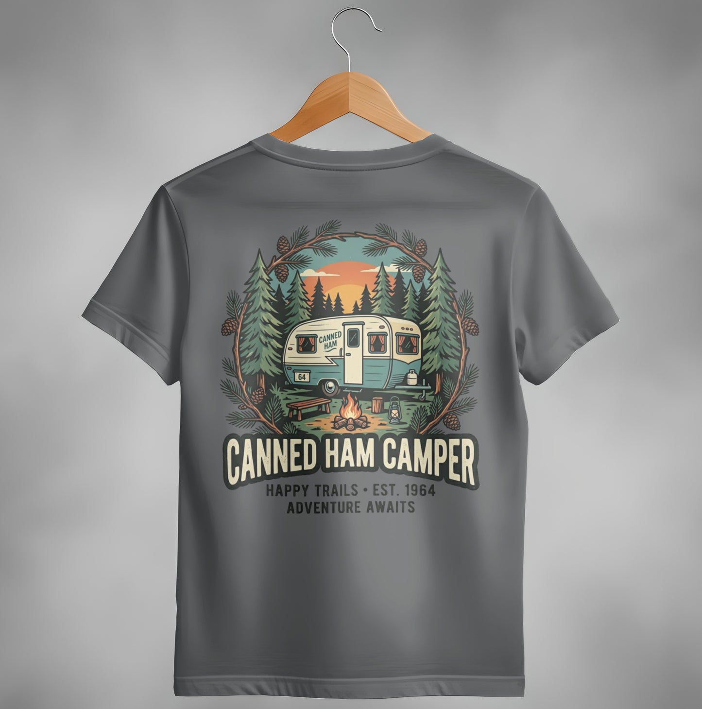 T-shirt with "Canned Ham Camper" logo featuring a vintage camper and forest scene.