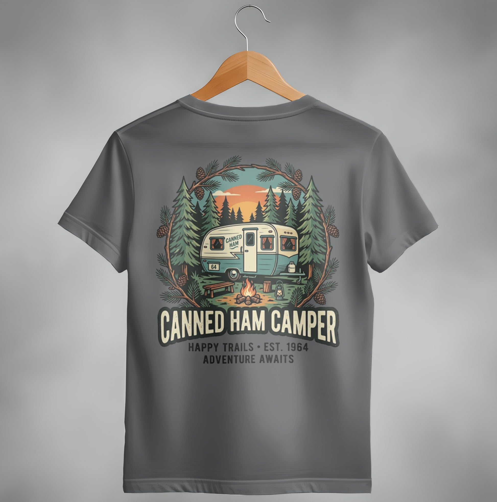 T-shirt with "Canned Ham Camper" logo featuring a vintage camper and forest scene.
