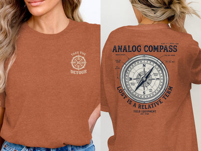 Orange t-shirt with "Take the Detour" graphic on front and analog compass design on back.