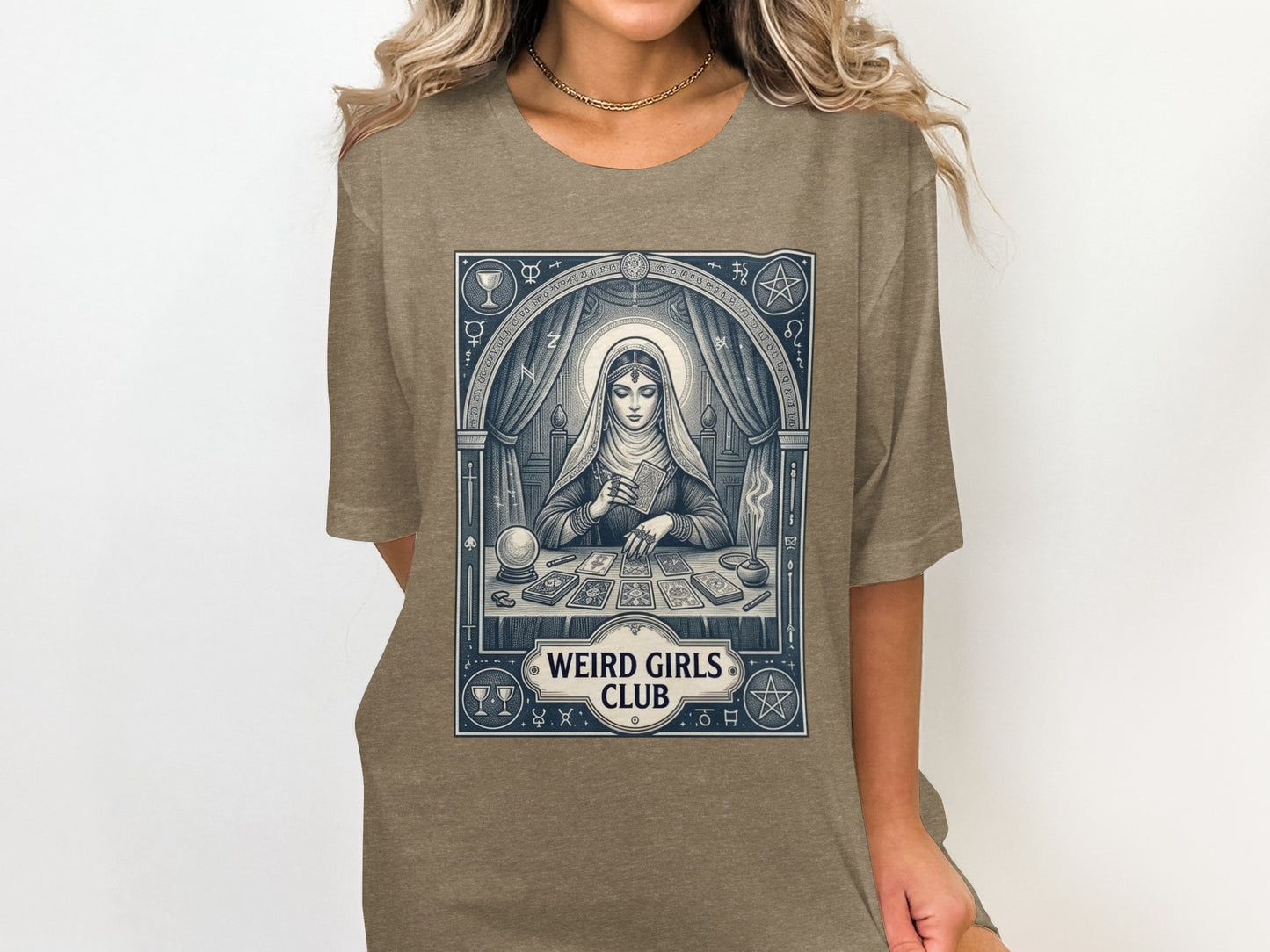 T-shirt graphic: woman with tarot cards, "Weird Girls Club" text.