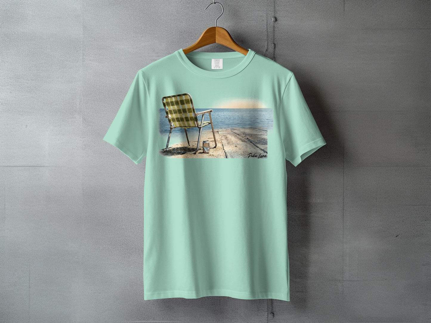 T-shirt with a beach chair on a pier at sunset graphic.