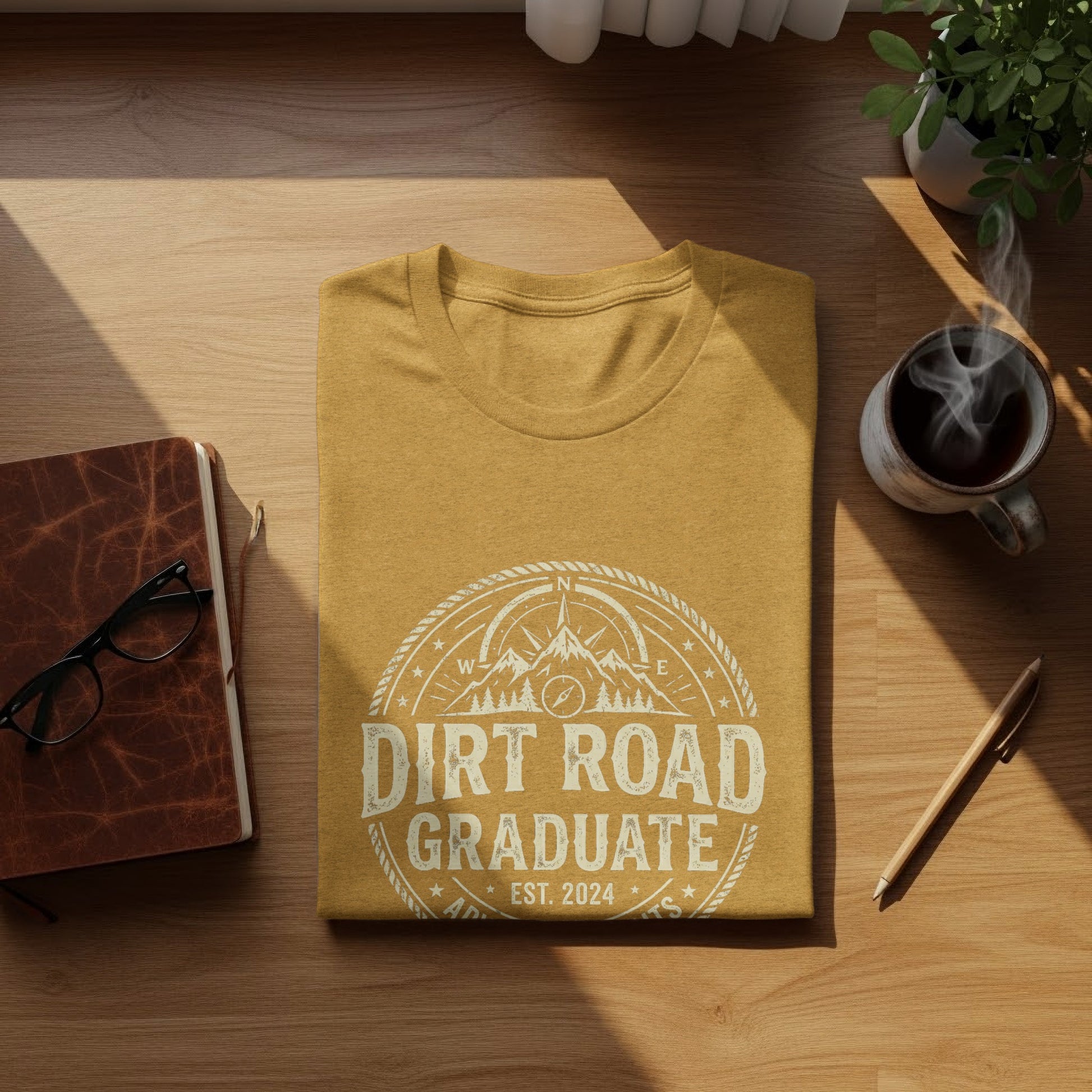 Dirt Road Graduate '24 Adventure | Vintage Outdoor Apparel: Mustard t-shirt with "Dirt Road Graduate Est. 2024" graphic design.