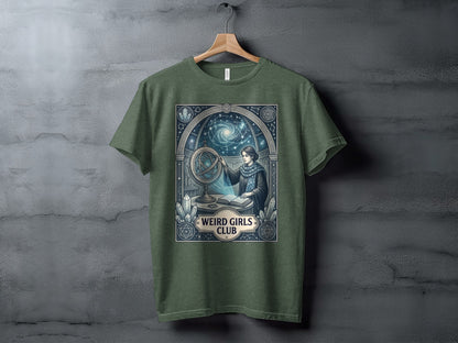 T-shirt with a celestial, art nouveau-style illustration of a woman with an orrery.