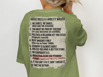 T-shirt with "House Rules & Liability Waiver" list printed on the back.