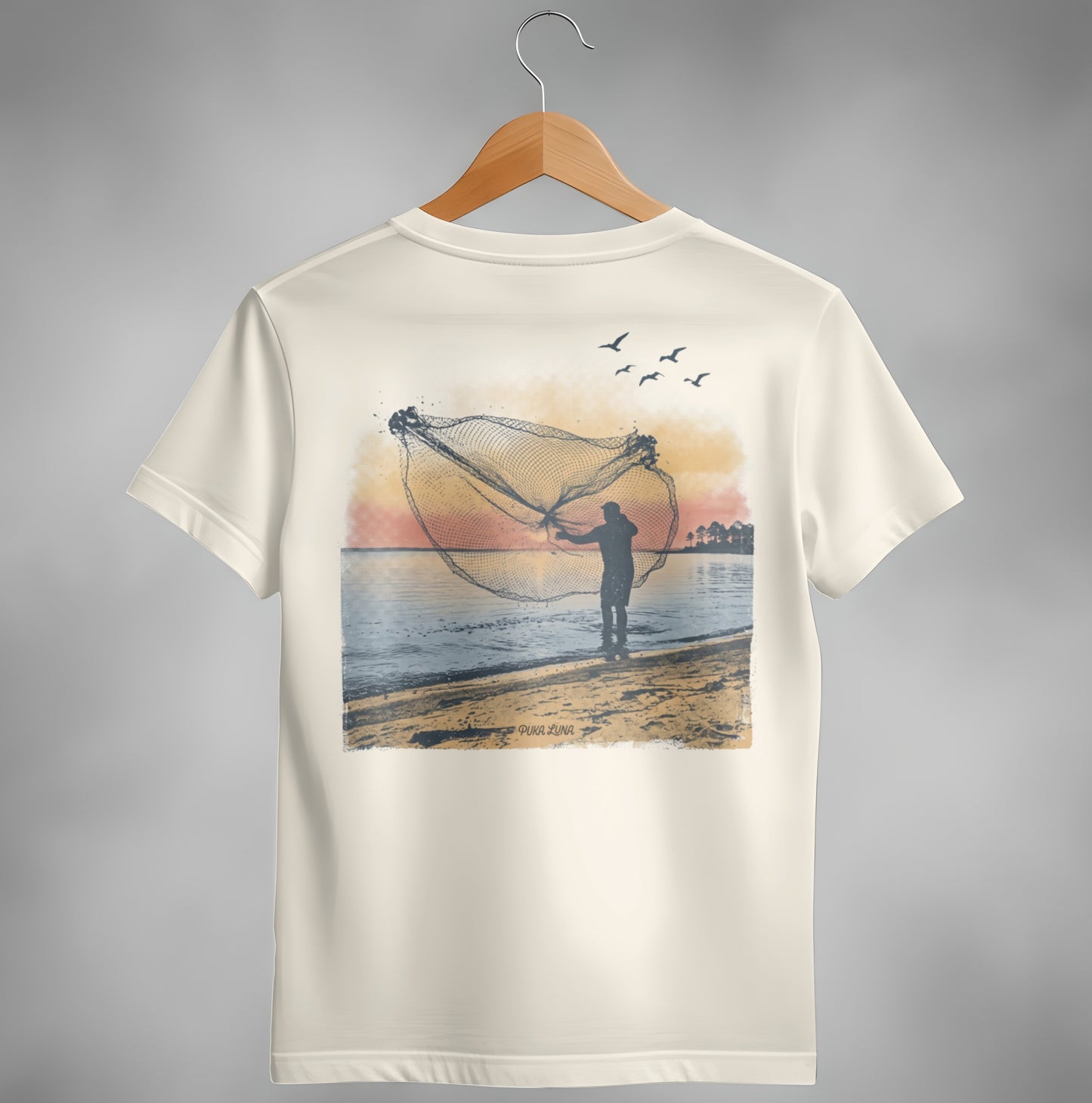 Fisherman casting a net at sunset with birds flying overhead.
