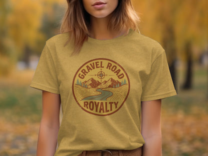 Gravel Road Royalty Adventure Tee | Vintage Outdoor Apparel: Gold t-shirt with "Gravel Road Royalty" circular logo featuring compass rose and mountains.