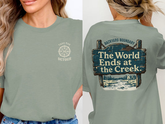 Sage green t-shirt with "Take the Detour" logo on front and "The World Ends at the Creek" design on back.