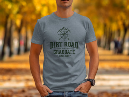 The Original Dirt Road Graduate Outdoor Adventure Top: Grey t-shirt with "Dirt Road Graduate Since 1988" and compass design.