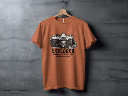 The Analog Explorer's Detour: Backcountry Outpost Shirt: Orange t-shirt with vintage camera graphic and text "Explorer Vintage Photography Analog Adventure Co."