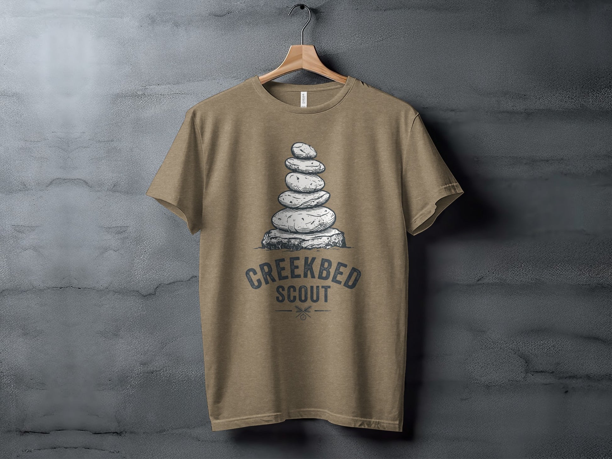 Creekbed Scout Cairn Graphic: The Explorer's Adventure Tee: T-shirt with stacked rocks graphic and "CREEKBED SCOUT" text.