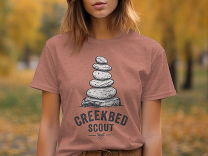 Creekbed Scout Cairn Graphic: The Explorer's Adventure Tee: T-shirt with stacked stones and "CREEKBED SCOUT" text.