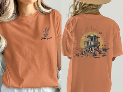 Orange t-shirt with "Puka Luna" text and beach lifeguard tower graphic.