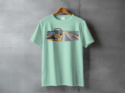 Pale blue t-shirt featuring a distressed graphic of a rusty truck and "FRESH CRAB" sign.
