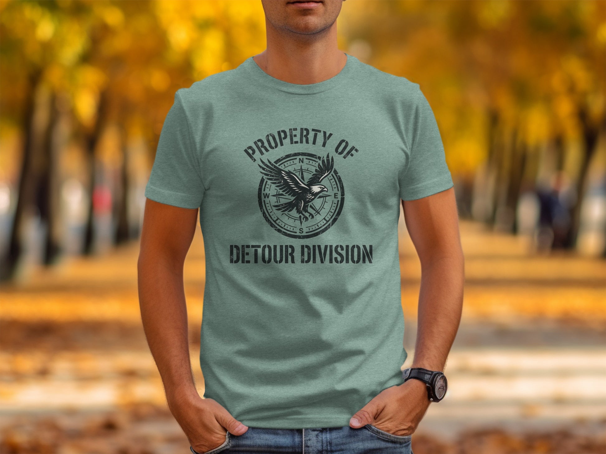 Rugged Detour Division Compass Eagle Tee Wilderness Shirt: Green t-shirt with "PROPERTY OF DETOUR DIVISION" and eagle graphic.