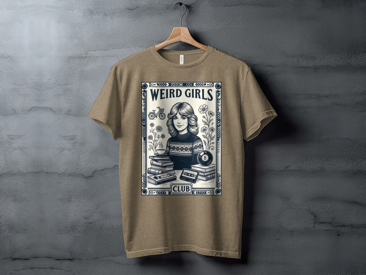T-shirt with "Weird Girls Club" text, woman, books, cassette tape, and flowers.