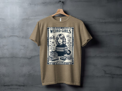 T-shirt with "Weird Girls Club" text, woman, books, cassette tape, and flowers.