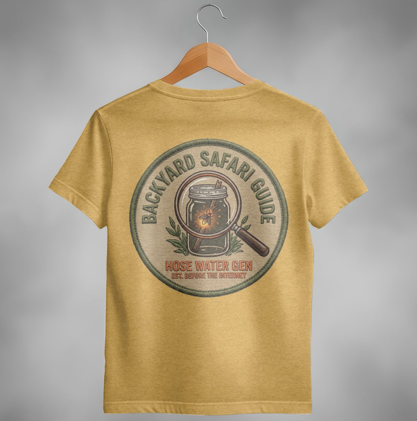 Backyard Safari Guide embroidered patch with a magnifying glass over a firefly.