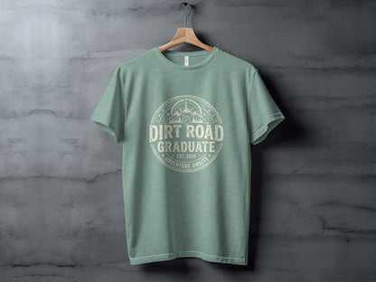 Dirt Road Graduate '24 Adventure | Vintage Outdoor Apparel: Green t-shirt with "Dirt Road Graduate Est. 2024 Adventure Awaits" text and compass design.
