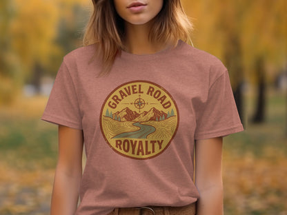 Gravel Road Royalty Adventure Tee | Vintage Outdoor Apparel: Gravel Road Royalty circular logo with mountains and compass rose on a rust colored t-shirt.