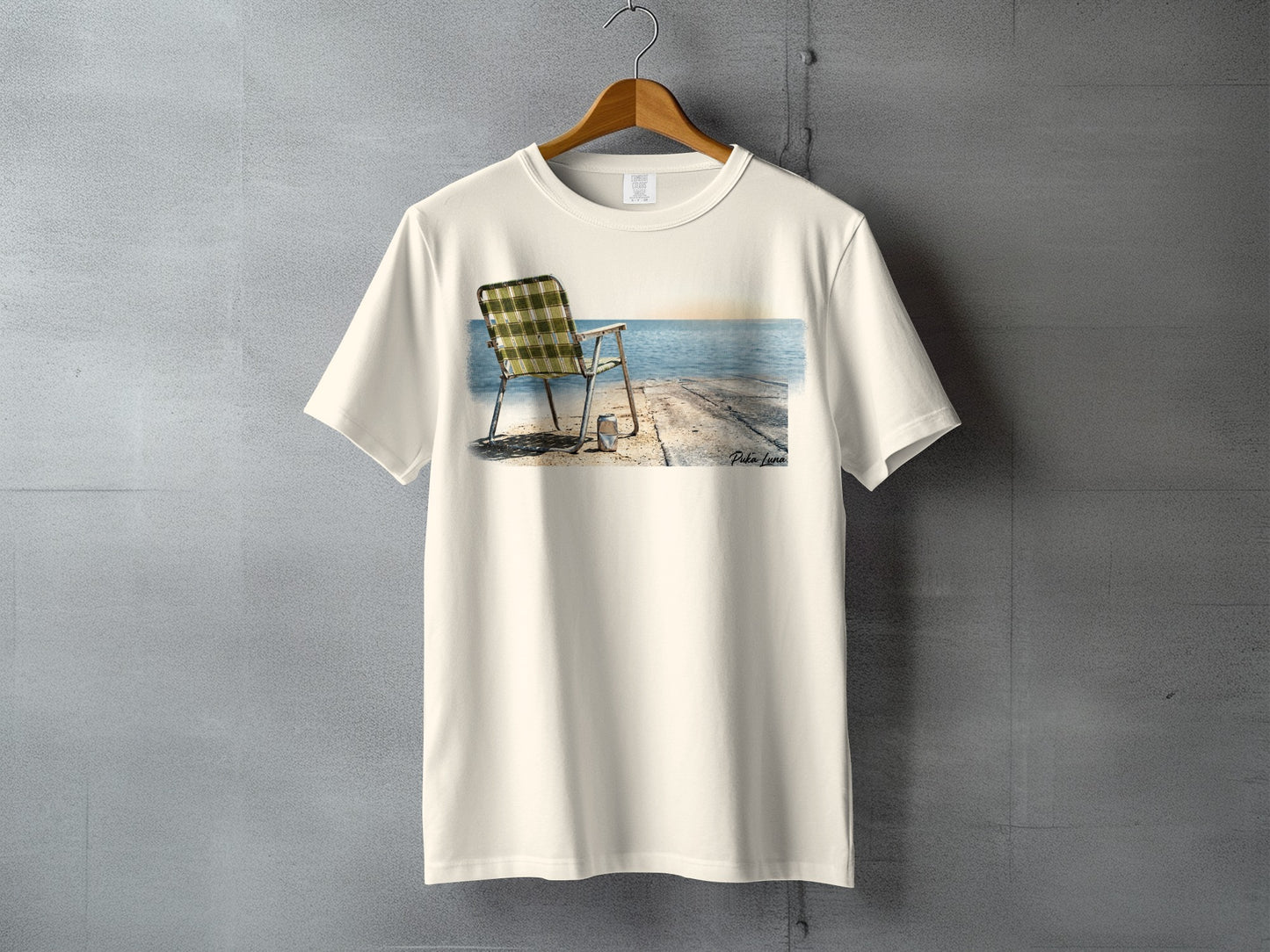 Cream t-shirt with a beach chair and pier graphic.