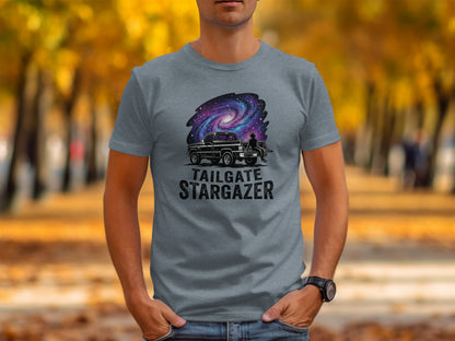 Heritage Cosmic Tailgate Stargazer Nomad Tee: Grey t-shirt with "TAILGATE STARGAZER" text and galaxy-themed truck graphic.