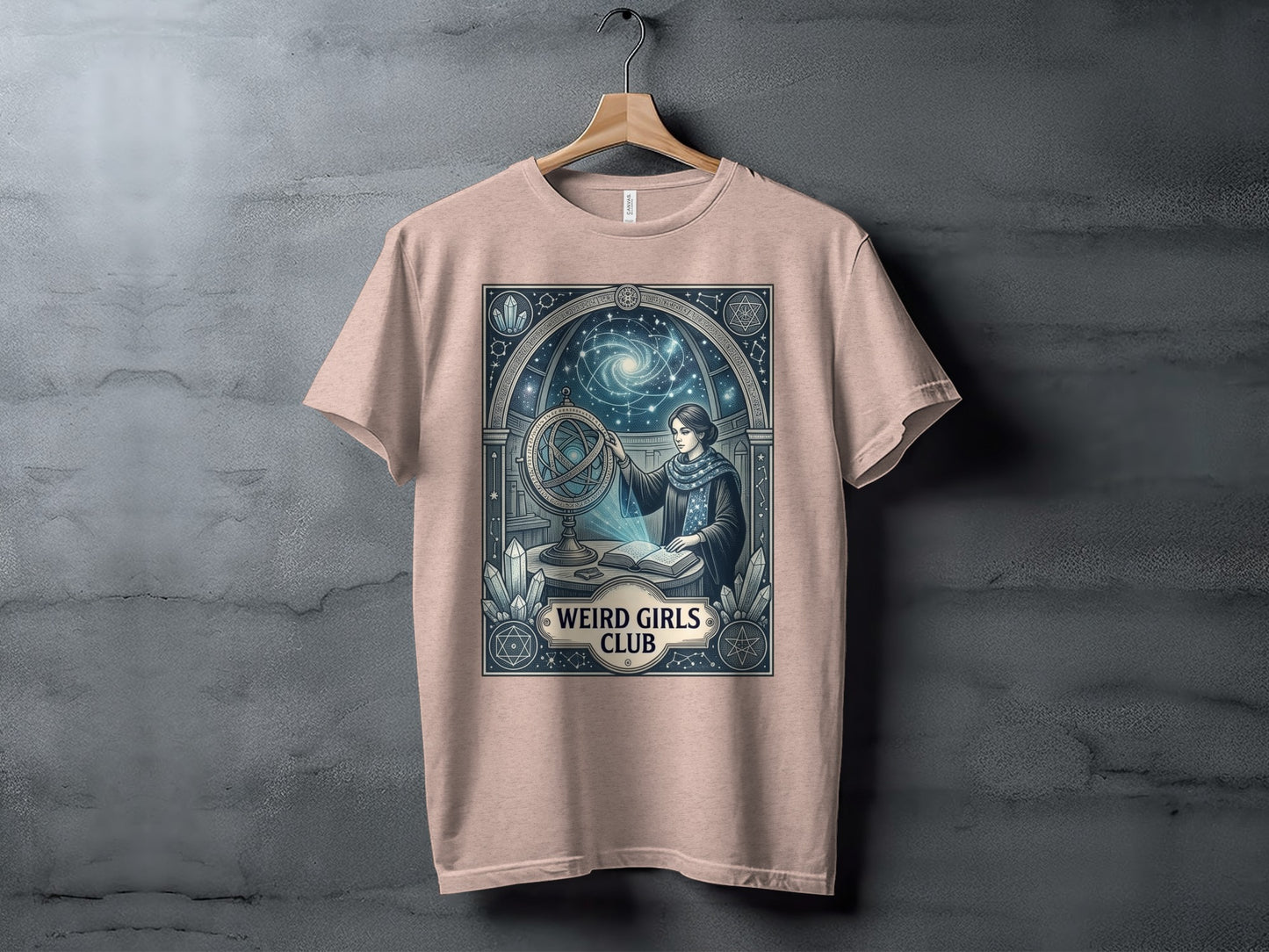 T-shirt with "Weird Girls Club" and celestial-themed illustration of a woman with an armillary sphere.