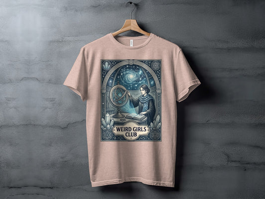 T-shirt with "Weird Girls Club" and celestial-themed illustration of a woman with an armillary sphere.