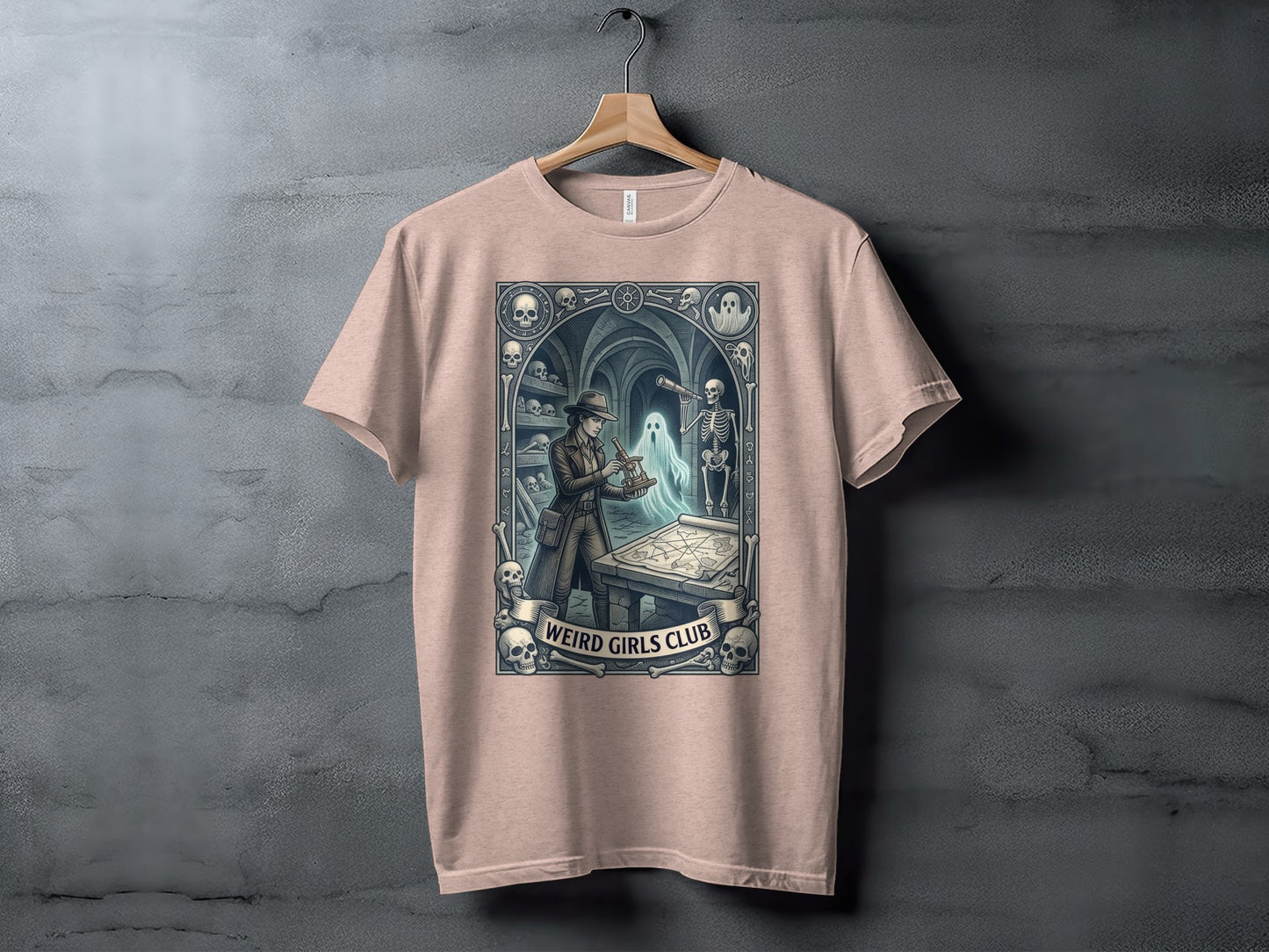 T-shirt featuring a macabre scene with skulls, skeletons, and a ghost exploring a map.