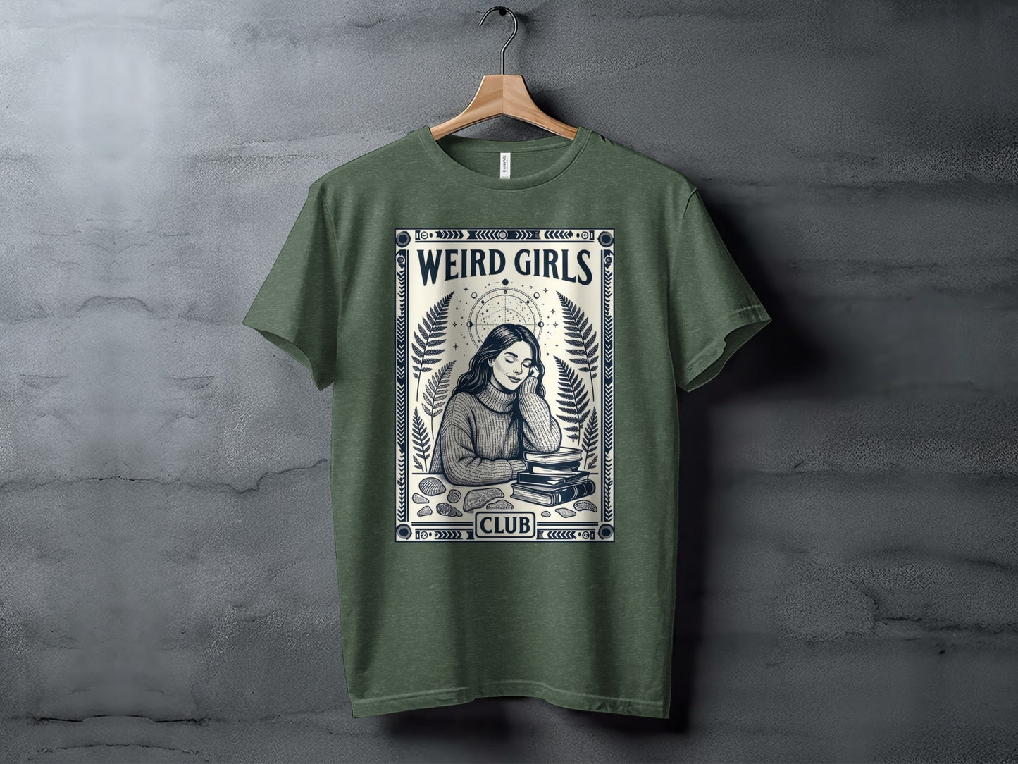 Green t-shirt with "Weird Girls Club" text and illustration of a girl reading.
