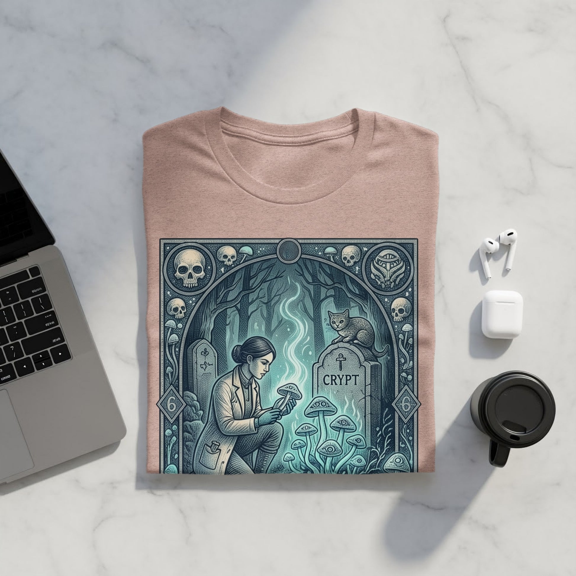 T-shirt featuring a dark fantasy graphic of a woman examining mushrooms near a tombstone.