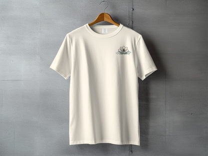 Cream t-shirt with a small floral logo on the left chest.